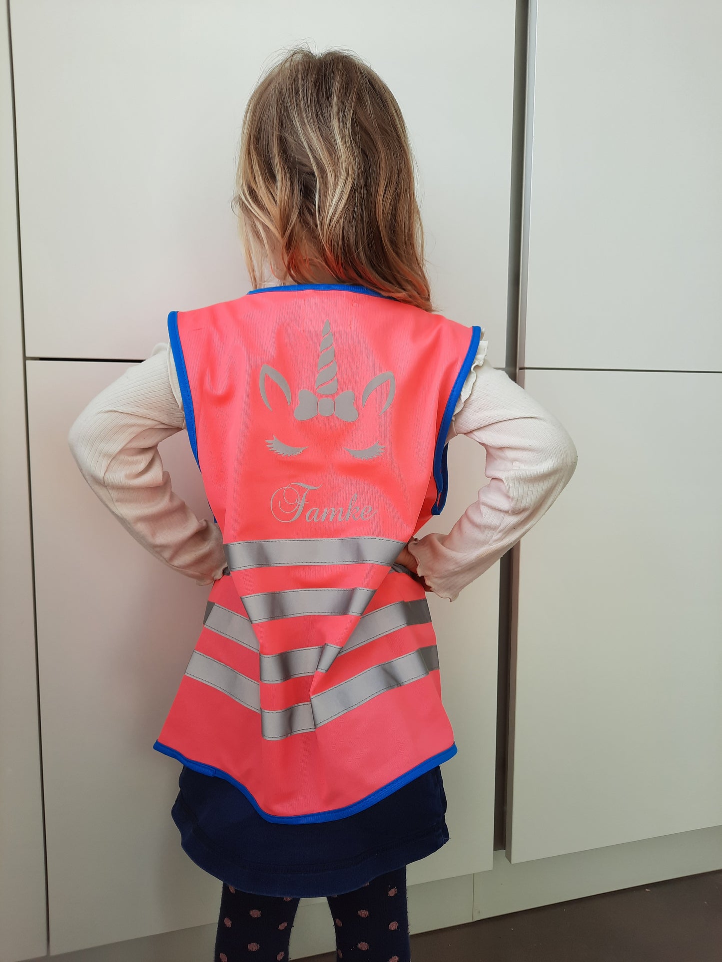 Fluohesje met naam en rits